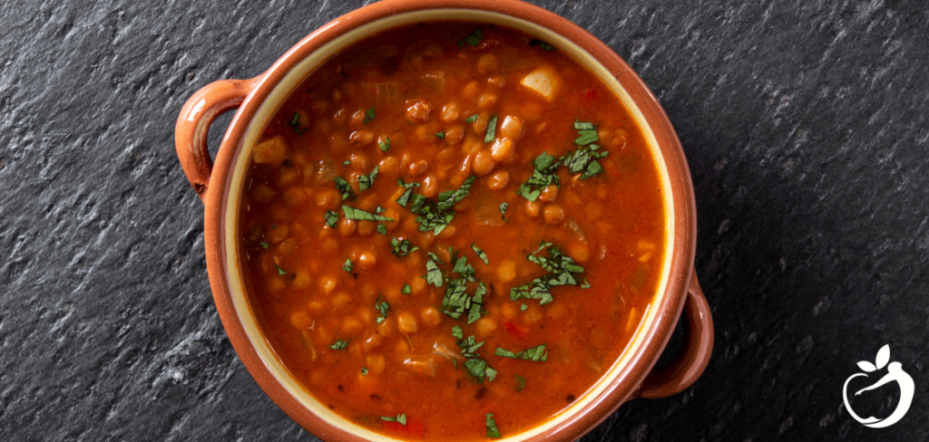 Recipe Post Header Image - Chicken and Lentil Soup. Image of lentil soup in a bowl.