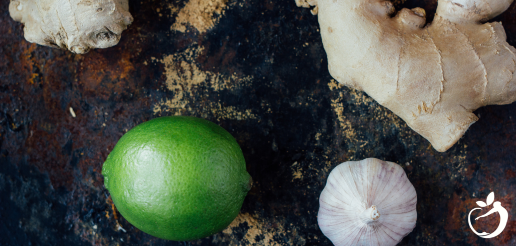 ginger, lime, and garlic on a table