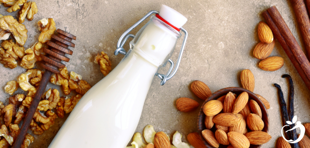 nuts and nut milk on a table