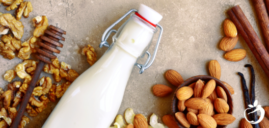 Nuts and nut milk in glass bottle