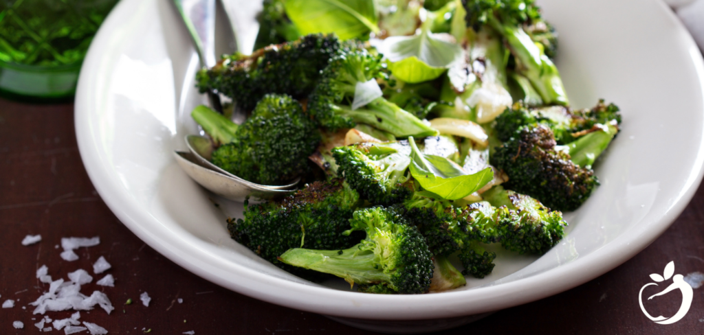 roasted broccoli with lemon and basil dressing on a plate