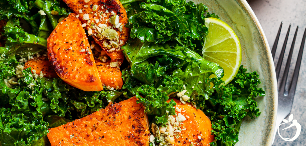 Recipe Post Header Image - Spicy Sweet Potato Power Bowl Recipe. Image of sweet potatoes, kale, and lime in a bowl.