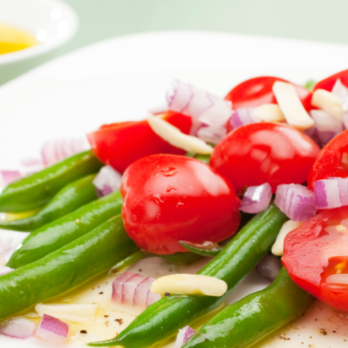 Image of Summer Green Bean and Tomato Salad on a plate.